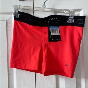 Nike Pro shorts - neon coral, size M